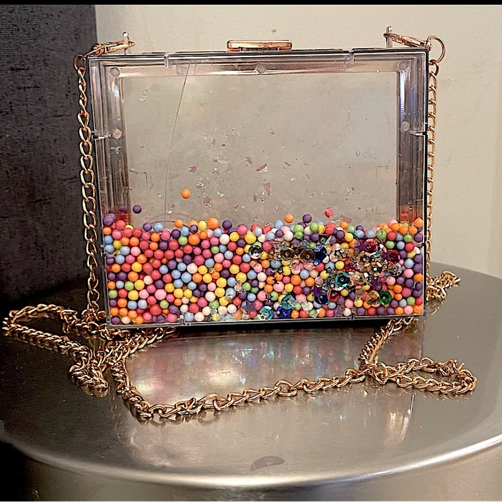Unique clear fashion handbag purse..gold accents removable chain (plastic)